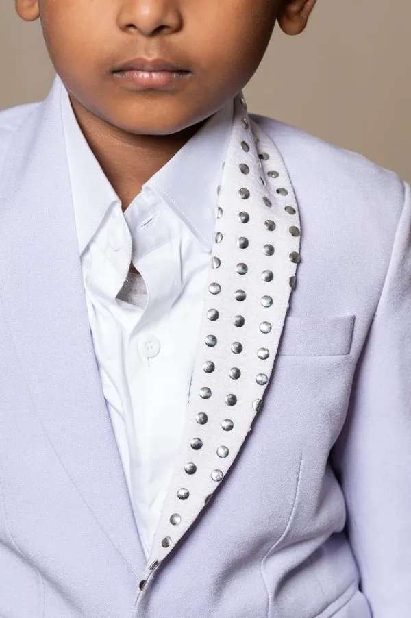 Trendy lavender blazer with metallic stud embellishments paired with classic white trousers, perfect for the modern young gentleman.