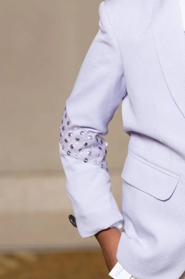 Trendy lavender blazer with metallic stud embellishments paired with classic white trousers, perfect for the modern young gentleman.